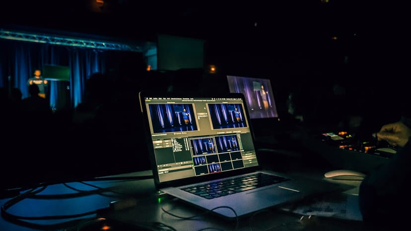 Multiple monitors showing live video feeds during a production